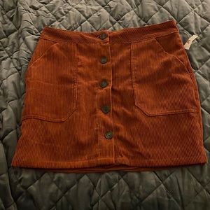 NWT lined burnt orange corduroy skirt. Size Medium.